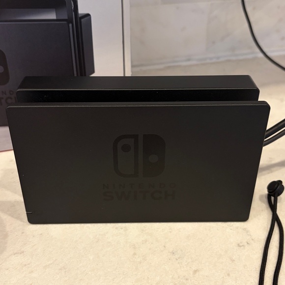 Nintendo Switch Console with Vibrant Red and Blue Controllers - Picture 8 of 8